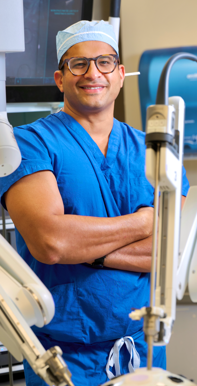 ART President standing beside a robotic surgical system