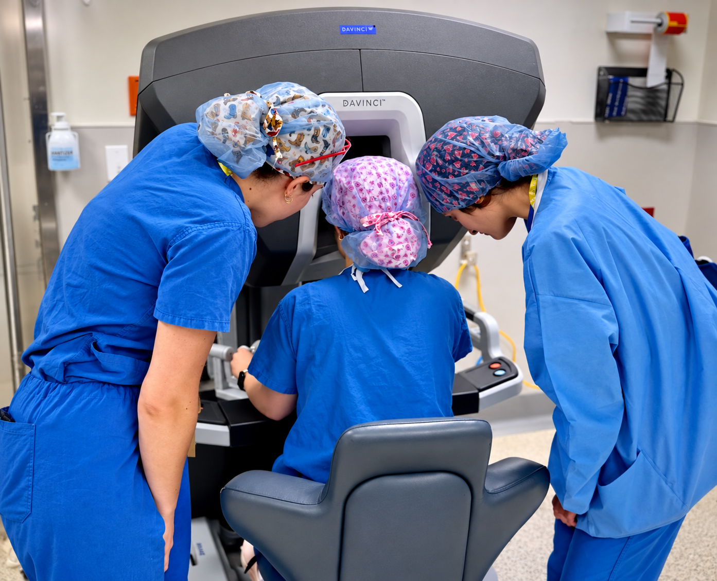 Transplant fellows and junior faculty participating in robotic surgery training at a da Vinci console